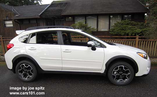 side view 2015 crystal white Subaru Crosstrek with optional side moldings and rear spoiler