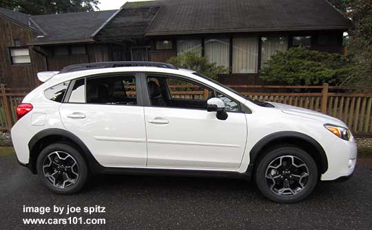 side view 2015 crystal white Subaru Crosstrek with optional side moldings and rear spoiler