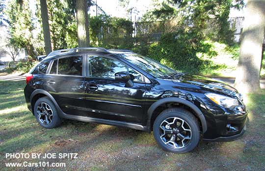 side view 2015 black Crosstrek Limited with optional side moldings and rear spoiler