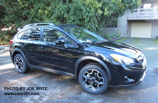 side view 2015 black Crosstrek Limited with optional side moldings and rear spoiler