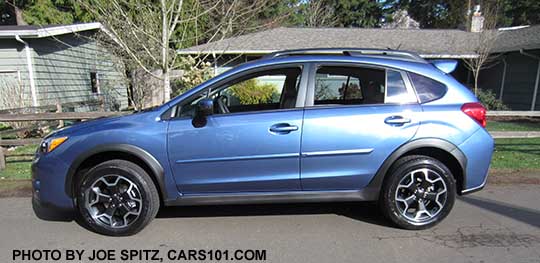 2015 Subaru Crosstrek, quartz blue color shown with optional body side moldings and rear spoiler