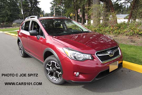 2015 Crosstrek 2.0i base model, venetian red car shown. Notice the black unpainted outside mirror