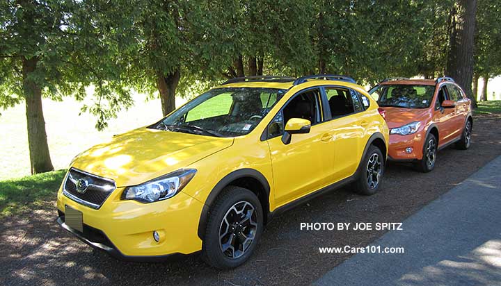 2015 Subaru Sunrise Yellow Crosstrek Premium Special Edition next to a Tangerine Orange Crosstrek