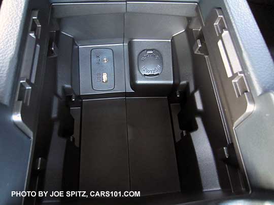 2016 Crosstrek center armrest storage bin with 12v power outlet, 3.5mm aux jack, single USB port