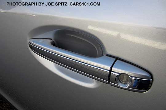 2016 Subaru Crosstrek Hybrid front door handle with chrome center accent strip,  body colored, driver's side shown with lock cylinder