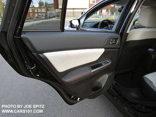 2016 Crosstrek rear inner door panel with orange stitching. Ivory cloth shown