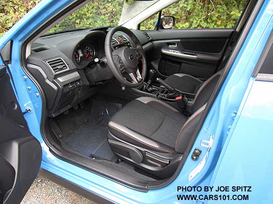 016 Subaru Crosstrek Premium dash, and black cloth front seat with orange stitching