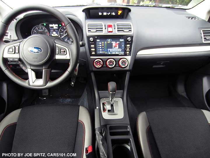 2016 Subaru Crosstrek Premium CVT with silver shift surround, black cloth with orange stitching.