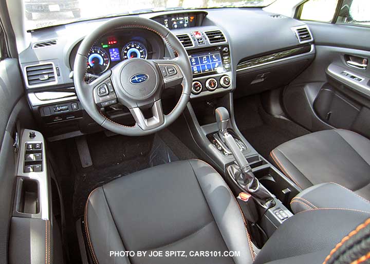 2016 Subaru Crosstrek Hybrid Touring interior, black leather with orange stitching, 7" audio, blue gauges, gloss black dash trim..