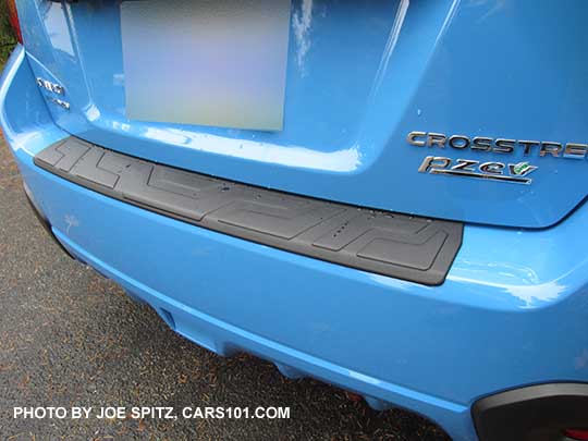 2016 Crosstrek optional rear bumper cover step pad, shown on a hyperblue car