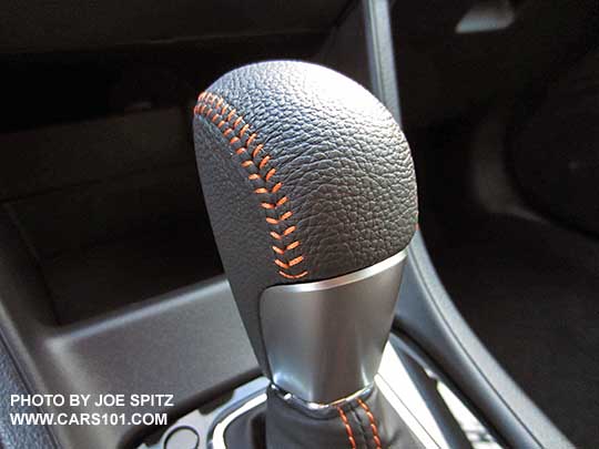 closeup of the 2016 Crosstrek CVT shift knob and shift boot with orange stitching