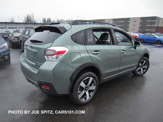 Subaru Crosstrek Hybrid Touring in the rain. Jasmine Green. No optional rear bumper cover.