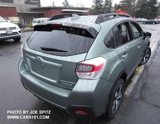 Subaru Crosstrek Hybrid Touring in the rain. Jasmine Green color