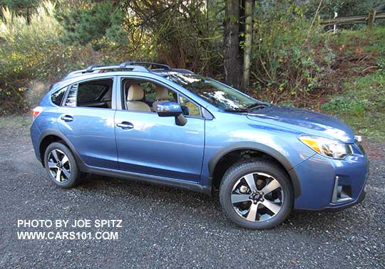 side view 2016 Quartz Blue Subaru Crosstrek Hybrid with optional cross bars