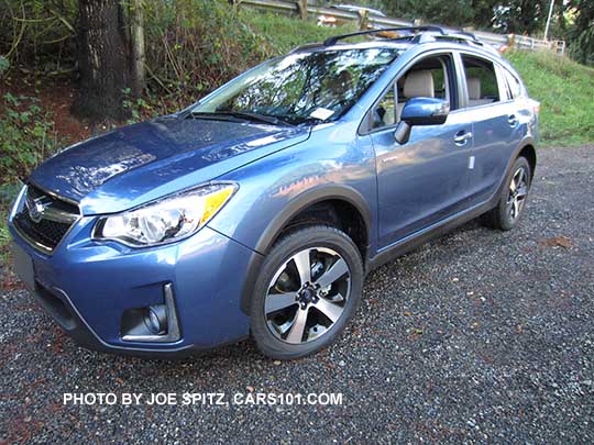 side view 2016 Quartz Blue Subaru Crosstrek Hybrid with optional cross bars