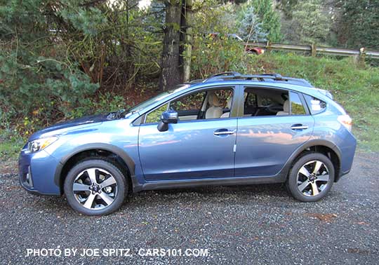 side view 2016 Quartz Blue Subaru Crosstrek Hybrid with optional cross bars