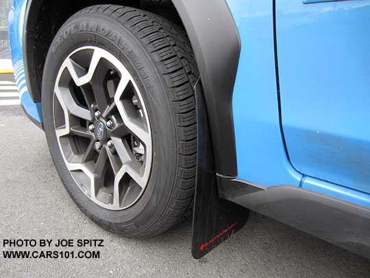 2016 Subaru Hyperblue color Crosstrek with aftermarket Rally Armor brand mud flaps, splash guards. Left front shown