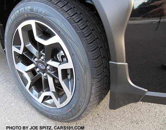 2016 Subaru Crosstrek optional splash guard, set of four, left rear shown, on a black car