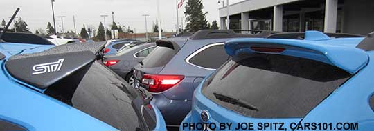 2017 and 2016 Subaru Crosstrek optional rear spoilers- body colored spoiler on the right and black STI rear spoiler on the left. Hyperblue Crosstreks shown.