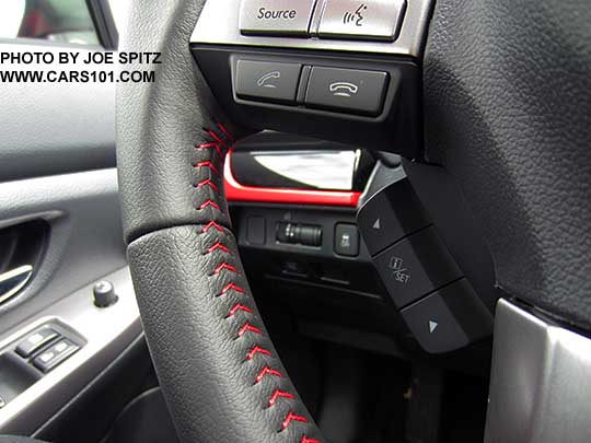 closeup of the 2016 Subaru Crosstrek Premium Special Edition steering wheel- leather wrapped, with red stitching