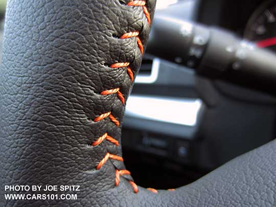 closeup of the orange stitching on the 2016 Crosstrek leather wrapped steering wheel