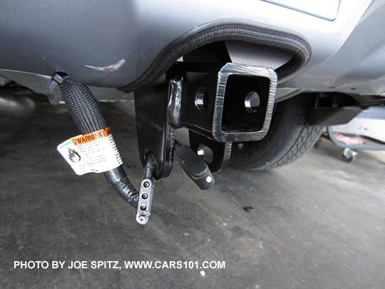 optional 2016 Crosstrek 1 1/4" trailer hitch comes with 4 pin connector (shown), and an insert and hitch plug (not shown). Notice how the hitch is nicely tucked up into a special bumper cutout.
