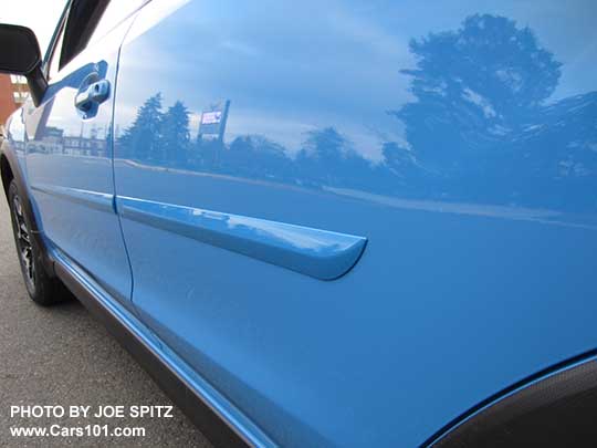 2017 Subaru Crosstrek optional body side moldings, body colored, shown on a hyperblue car.
