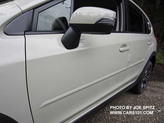 closeup of a 2017 khaki  colored Subaru Crosstrek optional khaki colored body side moldings