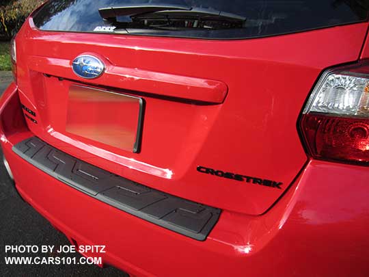 2017 Subaru Crosstrek Premium Special Edition has black rear logos. Pure red car shown.