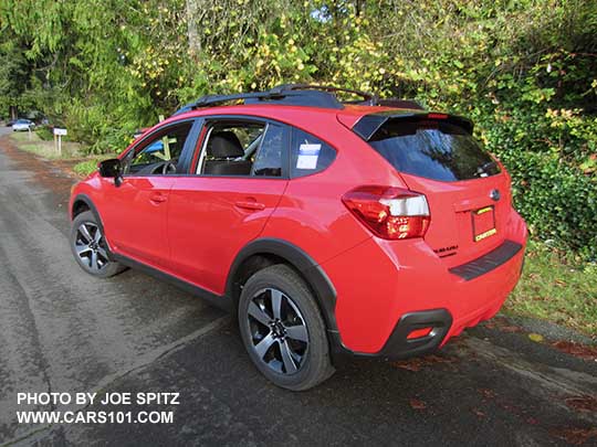 2017 Subaru Crosstrek Premium Special Edition showing rear spoiler's black rear edge and black logo. Pure red car shown.