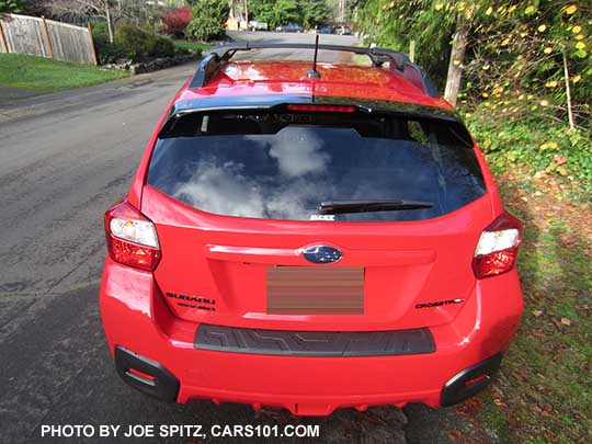 2017 Subaru Crosstrek Premium Special Edition rear view with black logos and rear spoiler edge. Pure red car shown.