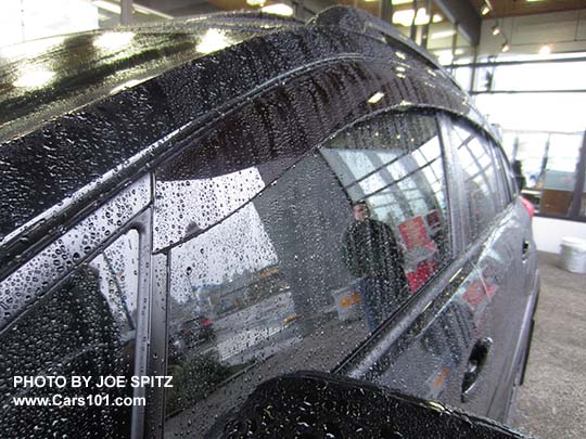 2017 Subaru Crosstrek optional side window rain drip moldings, shown in the rain
