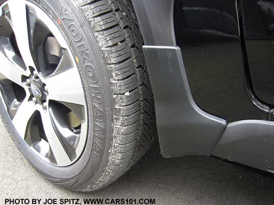 2017 Subaru Crosstrek optional splash guard, set of four, left front shown, on a black Premium Special Edition model