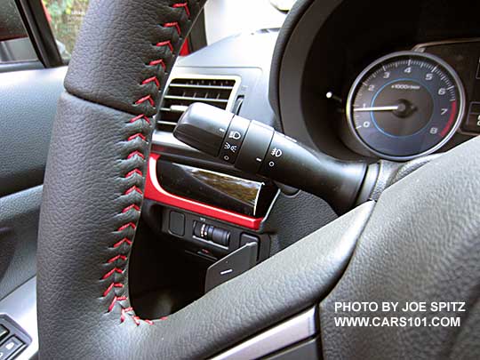 closeup of the 2017 Crosstrek Premium Special Edition gray leather wrapped steering wheel with red stitching.