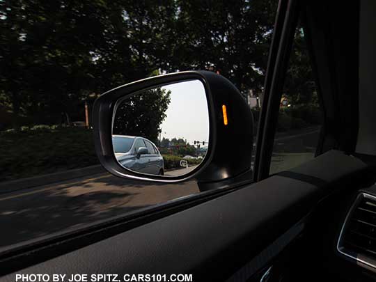 2018 Subaru Crosstrek's yellow blind spot detection symbol displays in the outside mirror housing  Driver side shown