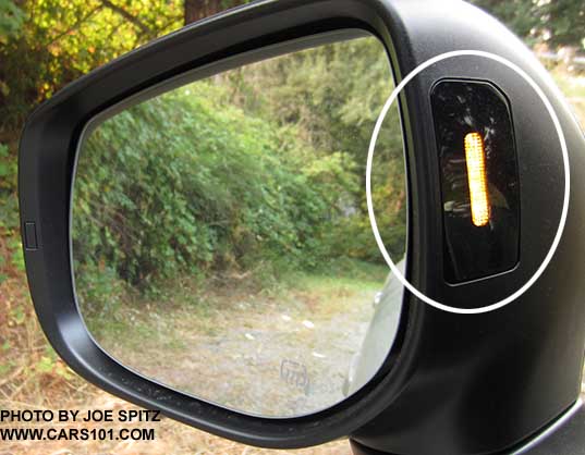 2018 Subaru Crosstrek's yellow blind spot detection symbol displays in the outside mirror housing (shown circled)