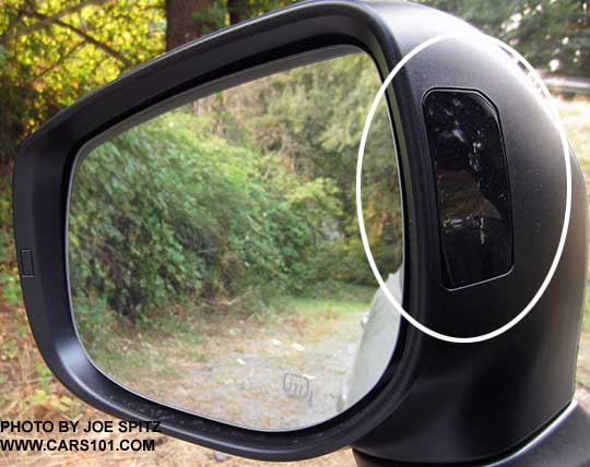2018 Subaru Crosstrek's yellow blind spot detection symbol displays in the outside mirror housing (shown off, circled)