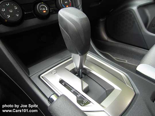 2018 Subaru Crosstrek 2.0i base model shift knob- vinyl covered with silver shift plate, with D drive and L low modes. No paddle shifters on the base 2.0i model.