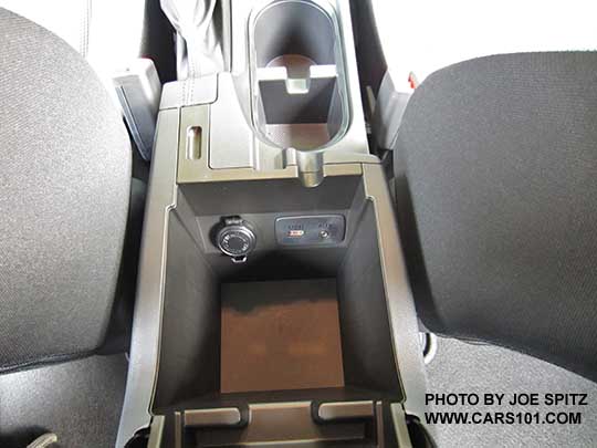 2018 Subaru Crosstrek 2.0i center console armrest storage with 12v power outlet, single USB, 3.5mm audio input.