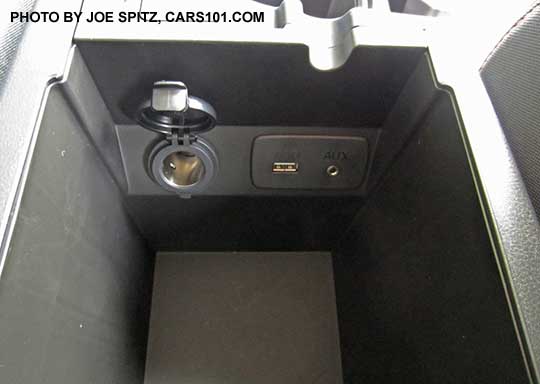 2018 Subaru Crosstrek 2.0i center console armrest storage with 12v power outlet, single USB, 3.5mm audio input.