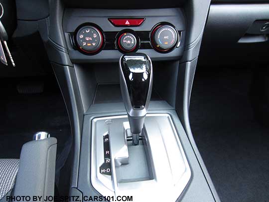 2018 Subaru Crosstrek Premium console with manual heater/ac controls and shift knob- leather wrapped base with silver sides and gloss black upper grip, and  silver shift plate, with D drive and M manual modes. The Premium and Limited models have paddle shifters with 7 'gear settings' for full driver control when needed.
