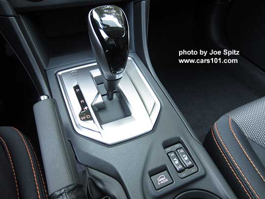 2018 Subaru Crosstrek Premium shift knob- leather wrapped base with silver sides and gloss black upper grip, and silver shift plate, with D drive and M manual modes. The Premium and Limited models have paddle shifters with 7 'gear settings' for full driver control when needed..