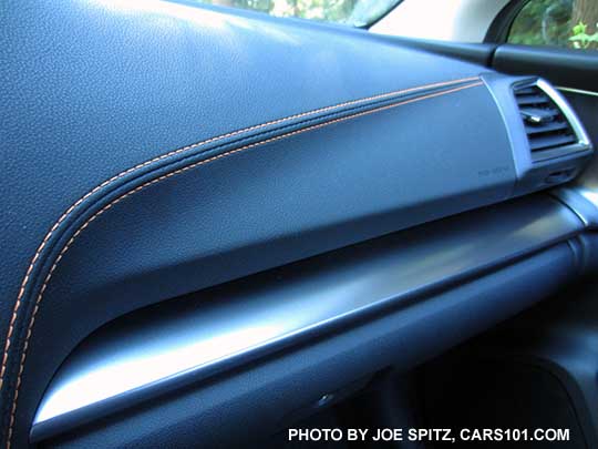 2018 Subaru Crosstrek Limited has silver dash trim, orange stitching, and silver vent trim