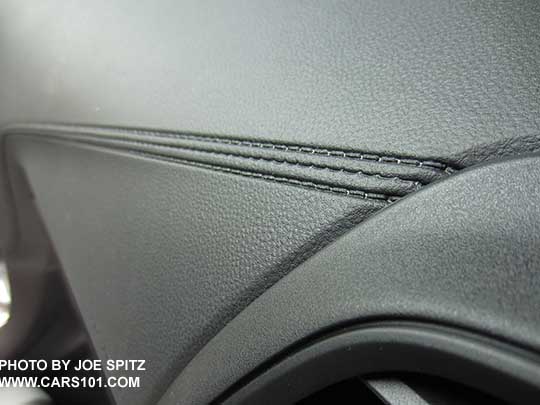 closeup of the 2018 Crosstrek 2.0i and Premium dash with dark gray carbon fiber patterned plastic trim, molded gray 'stitched' dash trim, gray vent trim