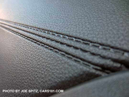 super closeup of the 2018 Subaru Crosstrek 2.0i and Premium molded gray plastic 'stitched'  passenger side dash trim.