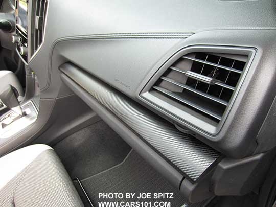 closeup of the 2018 Crosstrek 2.0i and Premium dash with dark gray carbon fiber patterned plastic trim, molded gray 'stitched' dash trim, gray vent trim