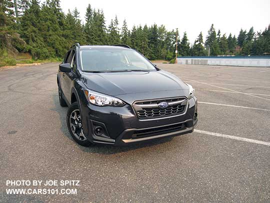 2018 Subaru Crosstrek 2.0i base model front grill (satin upper center accent bar), no fog lights,  dark gray  car shown