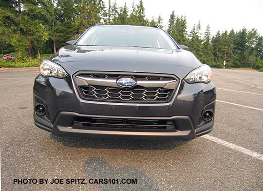 2018 Subaru Crosstrek 2.0i base model front grill (satin upper center accent bar) and fog lights, dark gray  car shown