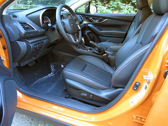 2018 Subaru Crosstrek Limited, black leather interior, sunshine orange car shown.