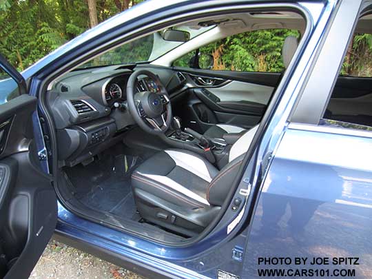 2018 Subaru Crosstrek Limited power driver's seat,  dark and light gray leather interior with orange stitching. Quartz blue car shown
